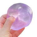 Purple Crystal Maltose Squishy Ball held in hand